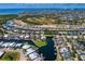 An aerial view displays a waterfront community with private docks, canals, and lush landscapes at 708 Islebay Dr, Apollo Beach, FL 33572
