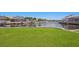 A waterfront home with a lush green lawn, and boat dock ready for the avid boating enthusiast at 708 Islebay Dr, Apollo Beach, FL 33572
