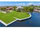 A waterfront property featuring a expansive lawn, private boat dock and a tranquil water view at 708 Islebay Dr, Apollo Beach, FL 33572
