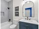 Bathroom featuring a modern vanity, marble countertops, and stylish fixtures with tub-shower combo at 708 Islebay Dr, Apollo Beach, FL 33572