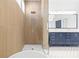 Bathroom features a sleek walk-in shower and double sink vanity with modern fixtures at 708 Islebay Dr, Apollo Beach, FL 33572