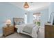 Cozy bedroom features natural light, neutral paint, and coastal decor at 708 Islebay Dr, Apollo Beach, FL 33572