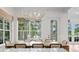 Bright dining room with a view of the pool and outdoor lounging area at 708 Islebay Dr, Apollo Beach, FL 33572