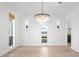 Bright dining room with hardwood floors, chandelier, and natural light from large windows at 708 Islebay Dr, Apollo Beach, FL 33572