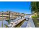 Boat dock with lift and dock is ready for the avid boating enthusiast in a waterfront community at 708 Islebay Dr, Apollo Beach, FL 33572