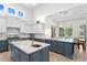 Gourmet kitchen with island with marble countertops, stainless steel appliances, and custom cabinetry at 708 Islebay Dr, Apollo Beach, FL 33572