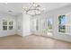 Bright living room with shutters and french doors that lead to outdoor living at 708 Islebay Dr, Apollo Beach, FL 33572