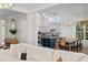 Bright, open-concept living room with a view of the stylish kitchen and dining area at 708 Islebay Dr, Apollo Beach, FL 33572