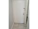 View of a closed bathroom door, with a partial view of the toilet at 7502 Bolanos Ct, Tampa, FL 33615