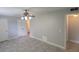 Spacious bedroom features tiled floors, a ceiling fan, and a closet with easy access to the ensuite bathroom at 7502 Bolanos Ct, Tampa, FL 33615