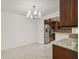 This dining room has tiled floors and adjacent kitchen at 7512 Dolonita Dr # 7512, Tampa, FL 33615