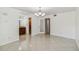 Open dining area with tile floors and chandelier, adjacent to bathroom and kitchen, creating a functional layout at 7512 Dolonita Dr # 7512, Tampa, FL 33615