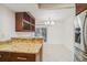 Dining room with tiled floors, wine rack, breakfast bar, and sliding glass doors at 7512 Dolonita Dr # 7512, Tampa, FL 33615