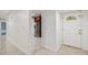 Inviting foyer with stylish tile flooring, a decorative front door, and convenient access to kitchen at 7512 Dolonita Dr # 7512, Tampa, FL 33615