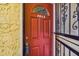 Condo front door, featuring an ornate security gate, and decorative window above the door at 7512 Dolonita Dr # 7512, Tampa, FL 33615
