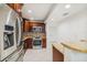 An updated kitchen with stainless steel appliances, granite countertops and mosaic backsplash at 7512 Dolonita Dr # 7512, Tampa, FL 33615