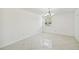 Well-lit living space with large window, tile flooring, and neutral walls, ideal for comfortable living at 7512 Dolonita Dr # 7512, Tampa, FL 33615