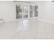 Light and airy room with sliding doors and tile flooring offers a clean and modern living space at 7512 Dolonita Dr # 7512, Tampa, FL 33615