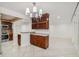 A living room adjacent to the kitchen and dining area with tiled floors and plenty of light at 7512 Dolonita Dr # 7512, Tampa, FL 33615