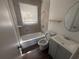 Cozy bathroom featuring tile flooring, a bathtub and shower combo, and vanity sink at 760 18Th S Ave, St Petersburg, FL 33705