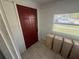 Mud room with tile floors, a red door, and a window at 760 18Th S Ave, St Petersburg, FL 33705