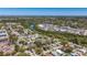 An aerial view shows the home's proximity to a nearby river and natural habitat at 7711 Dover N Ct, St Petersburg, FL 33709