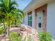 Welcoming front exterior with a cozy seating area and beautiful landscaping at 7755 39Th N Ave, St Petersburg, FL 33709