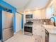 Modern kitchen featuring stainless steel refrigerator and range at 7755 39Th N Ave, St Petersburg, FL 33709