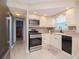Efficient kitchen layout with stainless steel appliances and modern finishes at 7755 39Th N Ave, St Petersburg, FL 33709
