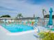Community swimming pool area complete with lounge chairs and umbrellas offering a refreshing escape at 7755 39Th N Ave, St Petersburg, FL 33709