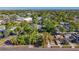 This aerial showcases a neighborhood with a mix of residential properties and nearby commercial buildings at 777 62Nd N Ave, St Petersburg, FL 33702
