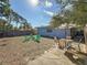 Backyard view of the home featuring green chairs, yard and a patio set at 777 62Nd N Ave, St Petersburg, FL 33702