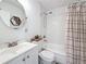 Bathroom featuring a white vanity, subway tiled shower, and a toilet with wooden accents at 777 62Nd N Ave, St Petersburg, FL 33702