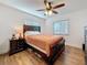 Cozy bedroom with a wood-framed bed, hardwood floors, and ample natural light at 777 62Nd N Ave, St Petersburg, FL 33702