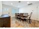 Bright dining area includes hardwood floors, a large dining table and neutral decor accents at 777 62Nd N Ave, St Petersburg, FL 33702