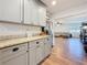 Charming kitchen featuring granite counters, gray cabinets, and seamless access to the living room at 777 62Nd N Ave, St Petersburg, FL 33702