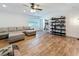 Inviting living room featuring hardwood floors, natural light, and comfortable neutral-colored seating at 777 62Nd N Ave, St Petersburg, FL 33702