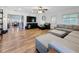 Large living room with hardwood floors, recessed lighting, and comfortable seating arrangements at 777 62Nd N Ave, St Petersburg, FL 33702