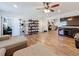 Open living space featuring hardwood floors, modern shelving, and seamless flow into the kitchen at 777 62Nd N Ave, St Petersburg, FL 33702