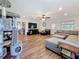 Open-concept living room with hardwood flooring, recessed lighting, and access to the kitchen at 777 62Nd N Ave, St Petersburg, FL 33702
