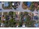 An aerial view shows the property is surrounded by mature trees in a well-established neighborhood at 8740 Forest Lake Dr, Port Richey, FL 34668