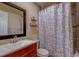 Bathroom featuring a tiled shower/tub, modern vanity, and neutral décor creating a serene atmosphere at 8740 Forest Lake Dr, Port Richey, FL 34668