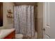 Bathroom featuring a tiled shower/tub, modern vanity, and neutral décor creating a serene atmosphere at 8740 Forest Lake Dr, Port Richey, FL 34668