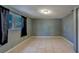 A bright and open bedroom with a window and tiled floor at 8740 Forest Lake Dr, Port Richey, FL 34668