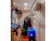 Walk-in closet featuring built-in shelves with organized clothing and storage bins at 8740 Forest Lake Dr, Port Richey, FL 34668