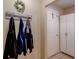 Entryway with coat rack and storage cabinet near the front door at 8740 Forest Lake Dr, Port Richey, FL 34668