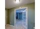 Cozy living space featuring tiled floors, doorway with glass panels, and neutral colored walls at 8740 Forest Lake Dr, Port Richey, FL 34668