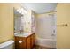 Bathroom featuring a single sink vanity and shower with bathtub; mirror and towel rack are visible as well at 891 Lantern Way # 13-103, Clearwater, FL 33765