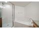 Bathroom showcasing a glass-enclosed shower and a relaxing soaking tub at 891 Lantern Way # 13-103, Clearwater, FL 33765