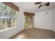 Bright bedroom with large windows offering natural light and a scenic view of the outdoors at 891 Lantern Way # 13-103, Clearwater, FL 33765